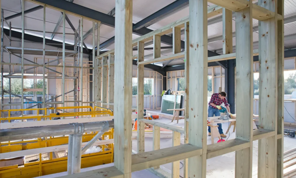 building-construction-site-interior-with-carpenter-2026-03-26-08-48-49-utc