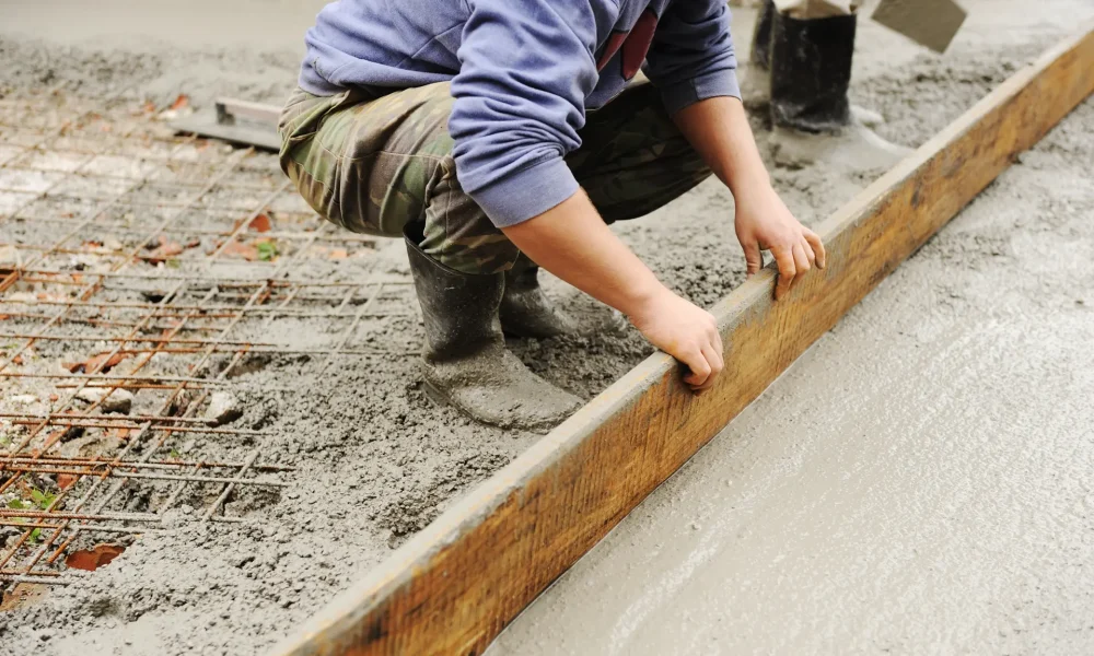 worker-smoothing-fresh-concrete-on-construction-si-2026-04-14-01-11-03-utc